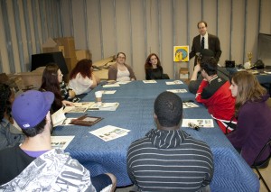 Dr. Benjamin Gross and TCNJ Press History students examining artifacts from the Sarnoff Collection.