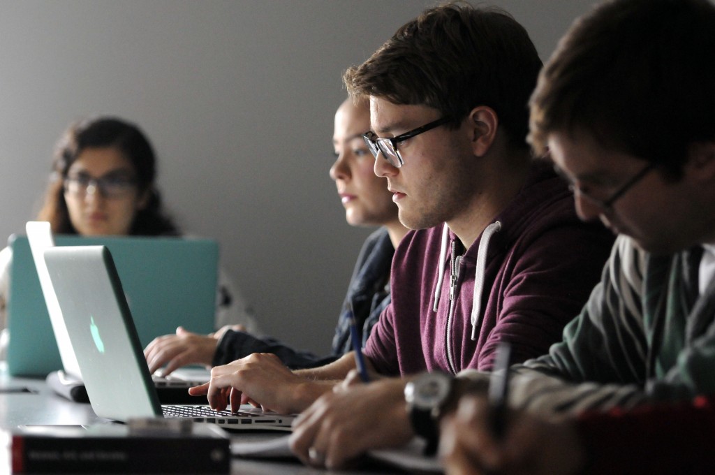 Students in class using laptops