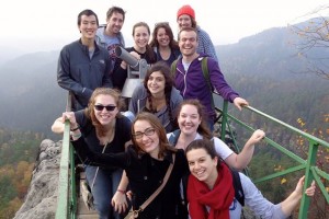 TCNJ students posing on a bridge.