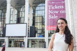 girl standing outside of theater