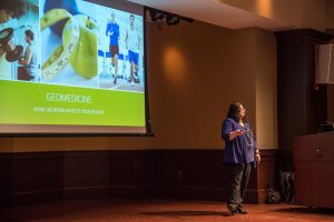 Dr. Amy Blatt speaking in front of presentation screen