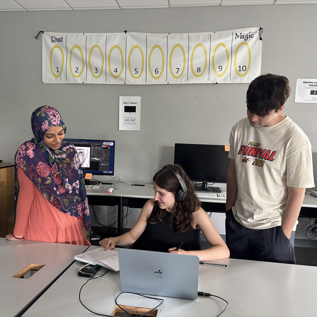 Student counselors interact with student campers at the Graphic Design camp.